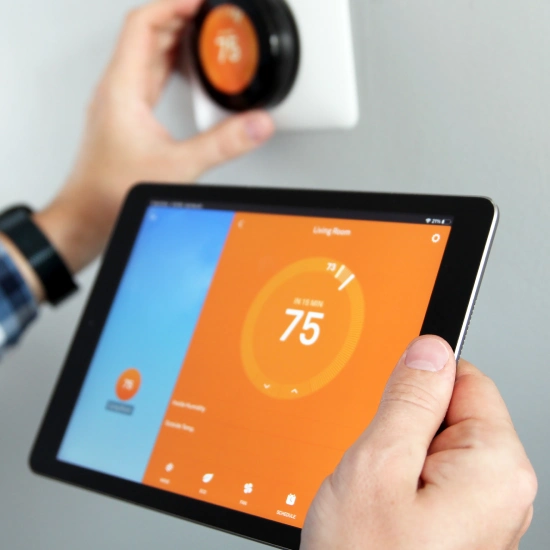 image of smart thermostat connected to ipad